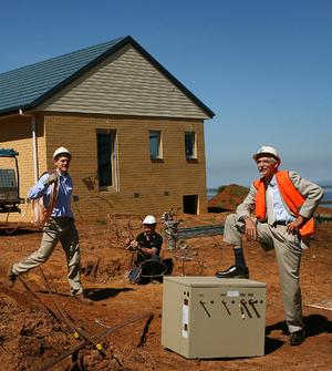 Ted Payne, 70, right, awaits the installation of a geothermal system at his Point Lonsdale house.